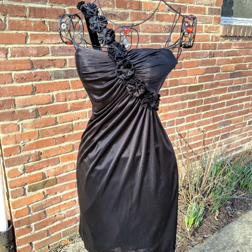 Black cocktail dress with flower accent